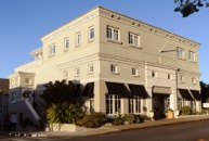 Exterior of building showing the penthouse suites on top